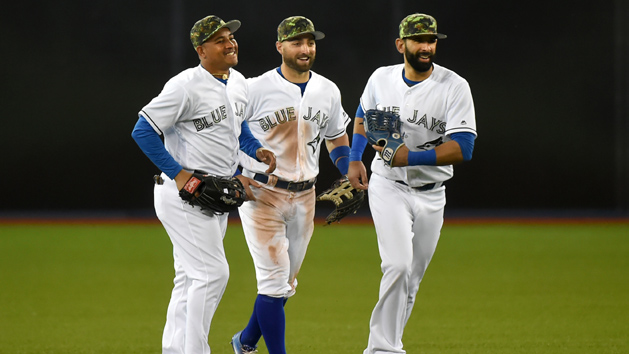 May 30, 2016; Toronto, Ontario, CAN; Toronto Blue Jays left fielder Ezequiel Carrera (3) and center fielder Kevin Pillar (11) and right fielder Jose Bautista (19) celebrate a 4-2 win over the New York Yankees at Rogers Centre. Mandatory Credit: Dan Hamilton-USA TODAY Sports