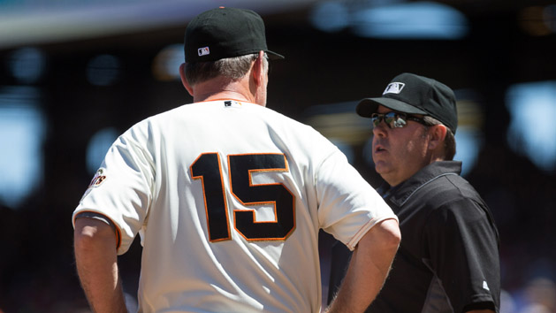 Jun 26, 2016; San Francisco, CA, USA; San Francisco Giants manager Bruce Bochy (15) visits with home plate umpire Doug Eddings (88) after the fifth inning against the Philadelphia Phillies at AT&T Park. Photo Credit: Kelley L Cox-USA TODAY Sports