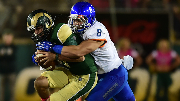 Oct 10, 2015; Fort Collins, CO, USA; Colorado State quarterback Nick Stevens (left) is sacked by Boise State Broncos defensive lineman Kamalei Correa (8) during the college football game at Hughes Stadium. Mandatory Credit: Austin Humphreys/The Coloradoan via USA TODAY Sports