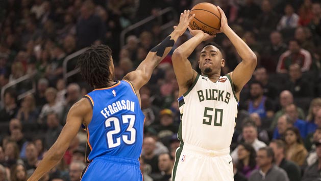 Apr 10, 2019; Milwaukee, WI, USA; Milwaukee Bucks forward Bonzie Colson (50) shoots the ball over Oklahoma City Thunder guard Terrance Ferguson (23) during the first quarter at Fiserv Forum. Photo Credit: Jeff Hanisch-USA TODAY Sports