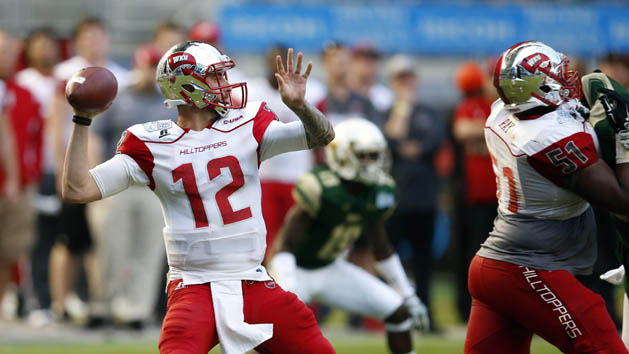 Dec 21, 2015; Miami, FL, USA; Western Kentucky Hilltoppers quarterback Brandon Doughty (12) throws a pass against South Florida Bulls during the second half in the 2015 Miami Beach Bowl at Marlins Park. Mandatory Credit: Steve Mitchell-USA TODAY Sports