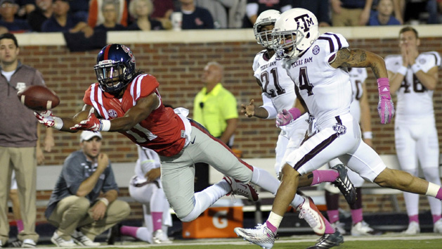 Oct 24, 2015; Oxford, MS, USA; Mississippi Rebels wide receiver Markell Pack (11) attempts to catch a pass against Texas A&M Aggies defensive back Noel Ellis (4) and Texas A&M Aggies defense back Brandon Williams (21) during the game at Vaught-Hemingway Stadium. Mandatory Credit: Justin Ford-USA TODAY Sports