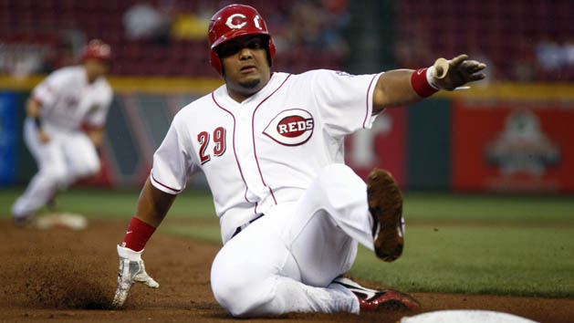 Sep 5, 2015; Cincinnati, OH, USA; Cincinnati Reds catcher Brayan Pena is forced out at third base against the Milwaukee Brewers during the second inning in game two of a doubleheader at Great American Ball Park. Mandatory Credit: David Kohl-USA TODAY Sports