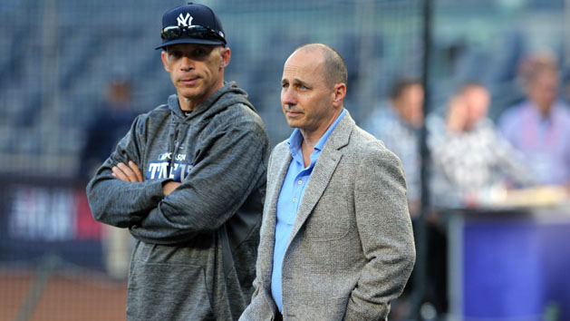 Oct 3, 2017; Bronx, NY, USA; New York Yankees manager Joe Girardi (left) talks to general manager Brian Cashman during batting practice before the 2017 American League wildcard playoff baseball game against the Minnesota Twins at Yankee Stadium. Photo Credit: Brad Penner-USA TODAY Sports