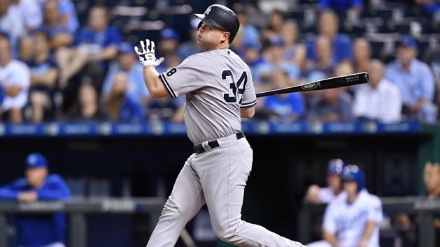 Aug 31, 2016; Kansas City, MO, USA; New York Yankees batter Brian McCann (34) hits a sacrifice fly to drive in the go ahead run against the Kansas City Royals during the thirteenth inning at Kauffman Stadium. The Yankees won 5-4. Photo Credit: Peter G. Aiken-USA TODAY Sports
