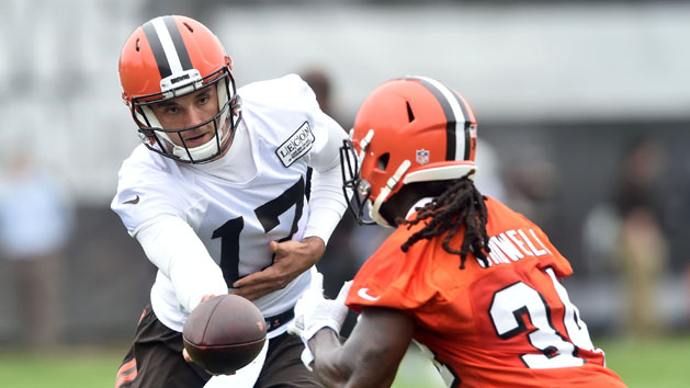 May 24, 2017; Berea, OH, USA; Cleveland Browns quarterback Brock Osweiler (17) hands off to running back Isaiah Crowell (34) during organized team activities at the Cleveland Browns training facility. Photo Credit: Ken Blaze-USA TODAY Sports