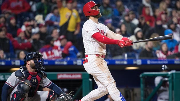 Mar 31, 2019; Philadelphia, PA, USA; Philadelphia Phillies right fielder Bryce Harper (3) hits a home run in front of Atlanta Braves catcher Brian McCann (16) during the seventh inning at Citizens Bank Park. Photo Credit: Bill Streicher-USA TODAY Sports