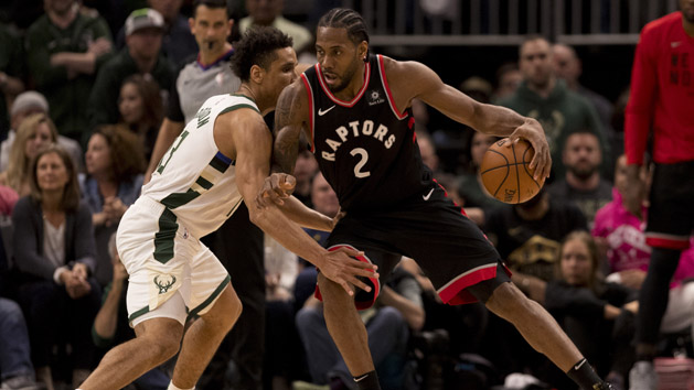 May 15, 2019; Milwaukee, WI, USA; Toronto Raptors forward Kawhi Leonard (2) drives for the basket against Milwaukee Bucks guard Malcolm Brogdon (13) during the fourth quarter in game one of the Eastern conference finals of the 2019 NBA Playoffs at Fiserv Forum. Photo Credit: Jeff Hanisch-USA TODAY Sports