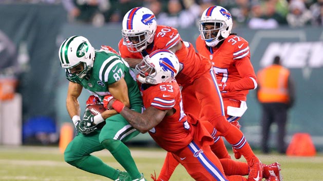 Nov 12, 2015; East Rutherford, NJ, USA; New York Jets wide receiver Eric Decker (87) catches a pass against Buffalo Bills linebacker Nigel Bradham (53) and Buffalo Bills safety Bacarri Rambo (30) and Buffalo Bills corner back Nickell Robey (37) during the third quarter at MetLife Stadium. The Bills defeated the Jets 22-17. Mandatory Credit: Brad Penner-USA TODAY Sports