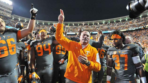 Oct 10, 2015; Knoxville, TN, USA; Tennessee Volunteers head coach Butch Jones waves to fans as he celebrates with his team after defeating the Georgia Bulldogs during the second half at Neyland Stadium. Tennessee won 38-31. Mandatory Credit: Jim Brown-USA TODAY Sports