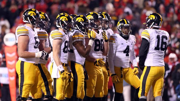 Nov 27, 2015; Lincoln, NE, USA; Iowa Hawkeyes quarterback C.J. Beathard (16) talks to his offense during the fourth quarter against the Nebraska Cornhuskers at Memorial Stadium. Iowa beat Nebraska 28-20. Mandatory Credit: Reese Strickland-USA TODAY Sports