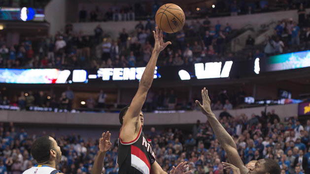 Feb 7, 2017; Dallas, TX, USA; Portland Trail Blazers guard C.J. McCollum (3) scores the game winning basket over Dallas Mavericks guard Devin Harris (34) and forward Dorian Finney-Smith (10) at the American Airlines Center. The Trail Blazers won 114-113. Photo Credit: Jerome Miron-USA TODAY Sports