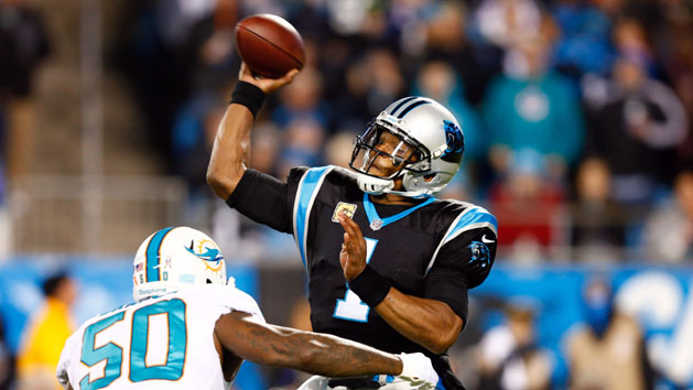 Nov 13, 2017; Charlotte, NC, USA; Carolina Panthers quarterback Cam Newton (1) passes the ball while under pressure by Miami Dolphins defensive end Andre Branch (50) in the first quarter at Bank of America Stadium. Photo Credit: Jeremy Brevard-USA TODAY Sports
