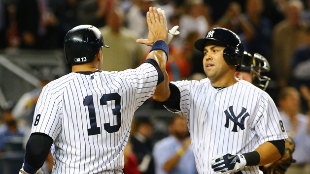 Sep 24, 2015; Bronx, NY, USA; New York Yankees right fielder Carlos beltran (36) is congratulated by designated hitter Alex Rodriguez (13) after hitting a three run home run against the Chicago White Sox in the third inning at Yankee Stadium. Mandatory Credit: Andy Marlin-USA TODAY Sports