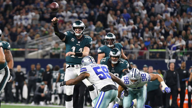 Nov 19, 2017; Arlington, TX, USA; Philadelphia Eagles quarterback Carson Wentz (11) throws a touchdown pass in the third quarter under pressure from Dallas Cowboys linebacker Anthony Hitchens (59) at AT&T Stadium. Photo Credit: Matthew Emmons-USA TODAY Sports