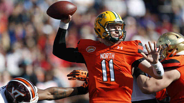 Jan 30, 2016; Mobile, AL, USA; North squad quarterback Carson Wentz of North Dakota State (11) throws while under pressure from South squad defensive end Dadi Nicolas of Virginia Tech during first half of the Senior Bowl at Ladd-Peebles Stadium. Mandatory Credit: Butch Dill-USA TODAY Sports