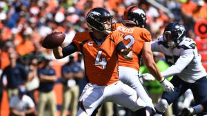 Keenum overcomes interceptions in Broncos debut