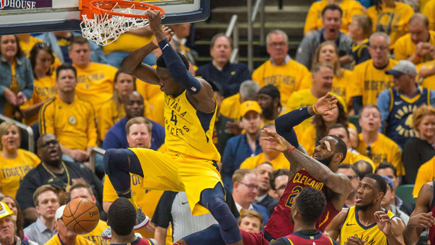 Apr 27, 2018; Indianapolis, IN, USA; Indiana Pacers guard Victor Oladipo (4) slam dunks the ball while Cleveland Cavaliers forward LeBron James (23) defends in the second half of game six in the first round of the 2018 NBA Playoffs at Bankers Life Fieldhouse. Photo Credit: Trevor Ruszkowski-USA TODAY Sports