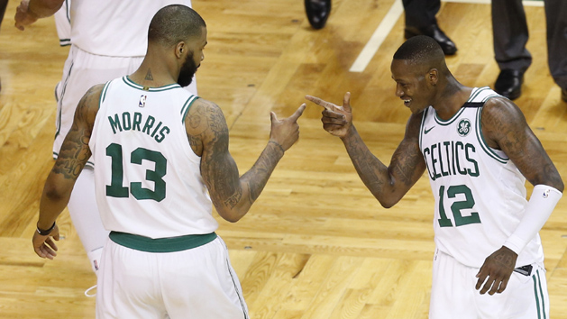 Apr 28, 2018; Boston, MA, USA; Boston Celtics forward Marcus Morris (13) and guard Terry Rozier (12) celebrate towards the end of the game against the Milwaukee Bucks in game seven of the first round of the 2018 NBA Playoffs at TD Garden. Photo Credit: Greg M. Cooper-USA TODAY Sports