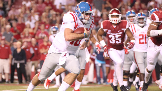 Oct 15, 2016; Fayetteville, AR, USA; Ole Miss Rebels quarterback Chad Kelly (10) rushes for a touchdown in the second quarter against the Arkansas Razorbacks at Donald W. Reynolds Razorback Stadium. Photo Credit: Nelson Chenault-USA TODAY Sports
