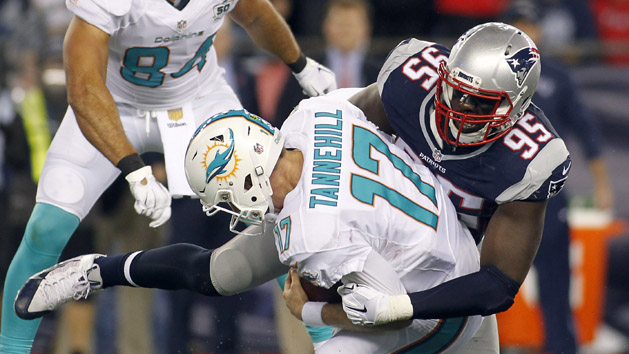 Oct 29, 2015; Foxborough, MA, USA; New England Patriots defensive end Chandler Jones (95) sacks Miami Dolphins quarterback Ryan Tannehill (17) during the second quarter at Gillette Stadium. Mandatory Credit: Stew Milne-USA TODAY Sports