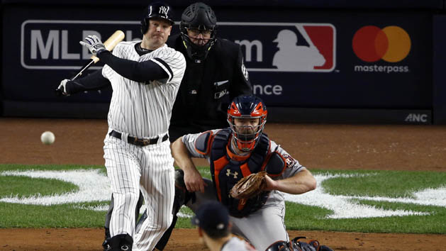 Oct 16, 2017; Bronx, NY, USA; New York Yankees third baseman Chase Headley (12) hits an RBI single during the fourth inning during game three of the 2017 ALCS playoff baseball series at Yankee Stadium. Photo Credit: Adam Hunger-USA TODAY Sports