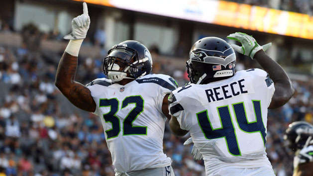 Aug 13, 2017; Carson, CA, USA; Seattle Seahawks running back Chris Carson (32) celebrates with fullback Marcel Reece (44) after scoring a touchdown against the Los Angeles Chargers in the first half during a preseason NFL game at StubHub Center. Photo Credit: Richard Mackson-USA TODAY Sports