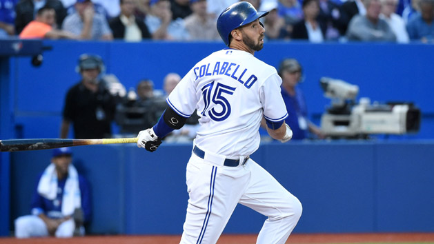 Aug 12, 2015; Toronto, Ontario, CAN; Toronto Blue Jays designated hitter Chris Colabello (15) hits a single to score a run against Oakland Athletics in the second inning at Rogers Centre. Mandatory Credit: Dan Hamilton-USA TODAY Sports