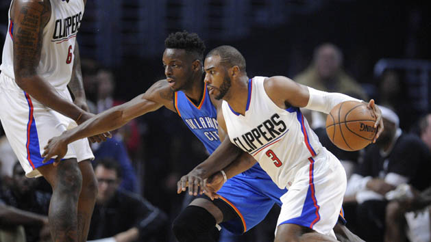 January 16, 2017; Los Angeles, CA, USA; Los Angeles Clippers guard Chris Paul (3) moves the ball as center DeAndre Jordan (6) covers against the Oklahoma City Thunder guard Victor Oladipo (5) during the first half at Staples Center. Photo Credit: Gary A. Vasquez-USA TODAY Sports