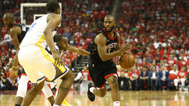 May 14, 2018; Houston, TX, USA; Houston Rockets guard Chris Paul (3) dribbles against Golden State Warriors forward Kevon Looney (5) during the second quarter in game one of the Western conference finals of the 2018 NBA Playoffs at Toyota Center. Photo Credit: Troy Taormina-USA TODAY Sports