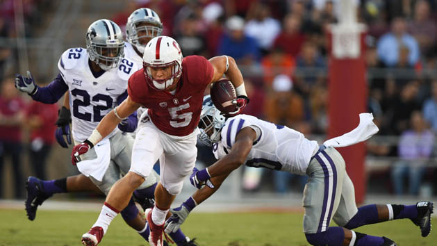 September 2, 2016; Stanford, CA, USA; Stanford Cardinal running back Christian McCaffrey (5) runs with the football past Kansas State Wildcats defensive back Dante Barnett (22) and defensive back Donnie Starks (10) during the second quarter at Stanford Stadium. Photo Credit: Kyle Terada-USA TODAY Sports