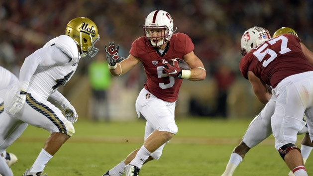 Oct 15, 2015; Stanford, CA, USA; Stanford Cardinal running back Christian McCaffrey (5) is defended by UCLA Bruins linebacker Kenny Young (42) in a NCAA football game at Stanford Stadium. Mandatory Credit: Kirby Lee-USA TODAY Sports