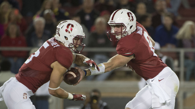 October 3, 2015; Stanford, CA, USA; Stanford Cardinal quarterback Kevin Hogan (8, right) hands the football off to running back Christian McCaffrey (5) against the Arizona Wildcats during the first quarter at Stanford Stadium. Mandatory Credit: Kyle Terada-USA TODAY Sports