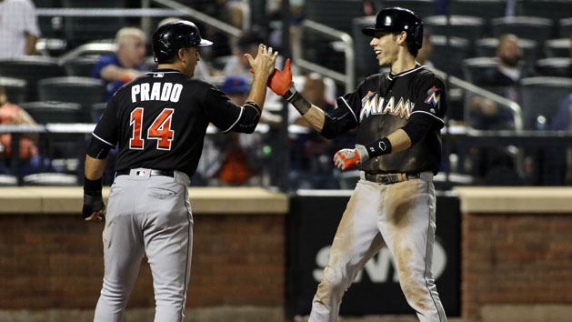 Sep 1, 2016; New York City, NY, USA; Miami Marlins center fielder Christian Yelich (21) is congratulated at home by teammate Martin Prado (14) after hitting a home run against the New York Mets at Citi Field. Photo Credit: Wendell Cruz-USA TODAY Sports