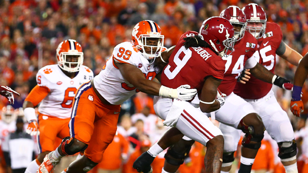 Jan 9, 2017; Tampa, FL, USA; Clemson Tigers defensive end Clelin Ferrell (99) tackles Alabama Crimson Tide running back Bo Scarbrough (9) in the 2017 College Football Playoff National Championship Game at Raymond James Stadium. Photo Credit: Mark J. Rebilas-USA TODAY Sports