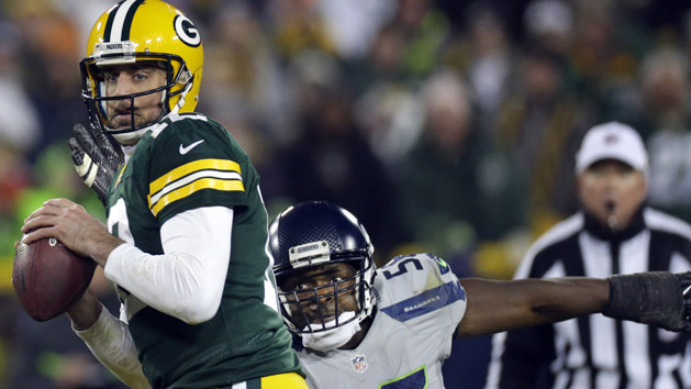 Dec 11, 2016; Green Bay, WS, USA; Green Bay Packers quarterback Aaron Rodgers (12) is pressured by Seattle Seahawks defensive end Cliff Avril (56) during the quarter at Lambeau Field. Photo Credit: Mark Hoffman/Milwaukee Journal Sentinel via USA TODAY NETWORK