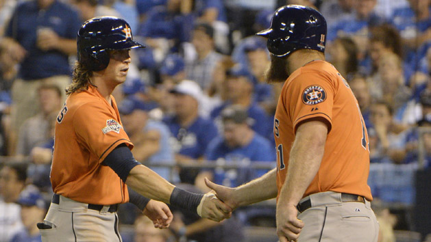 Oct 8, 2015; Kansas City, MO, USA; Houston Astros left fielder Colby Rasmus (28) celebrates with designated hitter Evan Gattis (11) after hitting a solo home run against the Kansas City Royals in the 8th inning in game one of the ALDS at Kauffman Stadium. Mandatory Credit: John Rieger-USA TODAY Sports