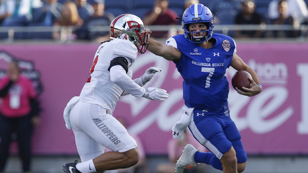 Dec 16, 2017; Orlando, FL, USA; Georgia State Panthers quarterback Conner Manning (7) stiff arms Western Kentucky Hilltoppers defensive back Devon Key (2) during the second quarter in the 2017 Cure Bowl at Camping World Stadium. Photo Credit: Reinhold Matay-USA TODAY Sports