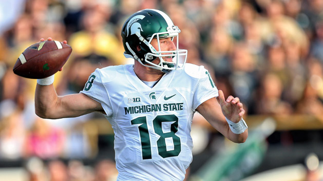 Sep 4, 2015; Kalamazoo, MI, USA; Michigan State Spartans quarterback Connor Cook (18) attempts to throw the ball against the Western Michigan Broncos prior to a game at Waldo Stadium. Mandatory Credit: Mike Carter-USA TODAY Sports