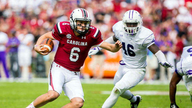 Oct 18, 2014; Columbia, SC, USA; South Carolina Gamecocks quarterback Connor Mitch (6) scrambles for yardage as Furman Paladins linebacker Cory Magwood (46) pursues in the second half at Williams-Brice Stadium. Mandatory Credit: Jeff Blake-USA TODAY Sports