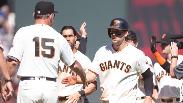 Jun 26, 2016; San Francisco, CA, USA; San Francisco Giants third baseman Conor Gillaspie (21) celebrates with manager Bruce Bochy (15) after hitting an RBI double for a walk off win against the Philadelphia Phillies at AT&T Park. The Giants won 8-7. Photo Credit: Kelley L Cox-USA TODAY Sports