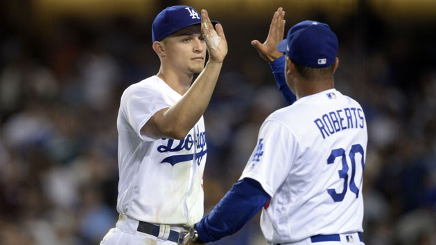 July 28, 2017; Los Angeles, CA, USA; Los Angeles Dodgers shortstop Corey Seager (5) celebrates with manager Dave Roberts (30) the victory against the San Francisco Giants at Dodger Stadium. Photo Credit: Gary A. Vasquez-USA TODAY Sports