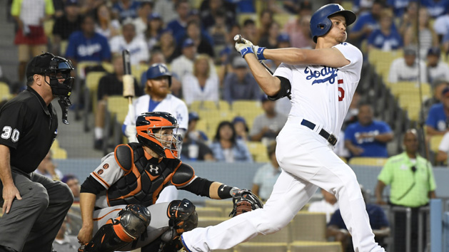 Aug 23, 2016; Los Angeles, CA, USA; Los Angeles Dodgers shortstop Corey Seager (5) hits a double against the San Francisco Giants at Dodger Stadium. Photo Credit: Richard Mackson-USA TODAY Sports