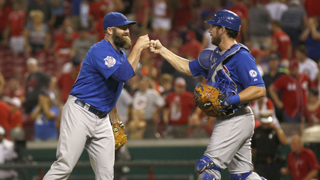 Jul 22, 2015; Cincinnati, OH, USA; Chicago Cubs relief pitcher Jason Motte (L) celebrates with catcher Taylor Teagarden (R) after defeating the Chicago Cubs 6-5 at Great American Ball Park. Mandatory Credit: David Kohl-USA TODAY Sports