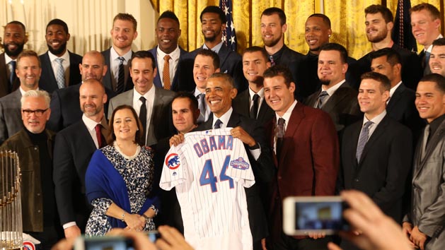 Jan 16, 2017; Washington, DC, USA; President Barack Obama holds a gift jersey while posing with members of the Chicago Cubs at a ceremony honoring the 2016 World Series Champion Cubs in the East Room at the White House. Photo Credit: Geoff Burke-USA TODAY Sports