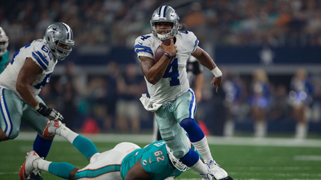 Aug 19, 2016; Arlington, TX, USA; Dallas Cowboys quarterback Dak Prescott (4) runs from Miami Dolphins defensive Deandre Coleman (62) during the second quarter at AT&T Stadium. Photo Credit: Jerome Miron-USA TODAY Sports