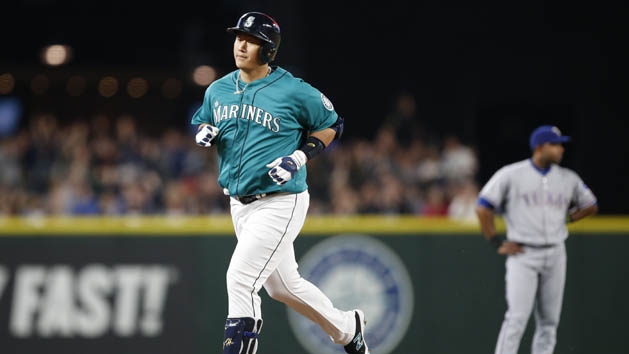 Jun 10, 2016; Seattle, WA, USA; Seattle Mariners first baseman Dae-Ho Lee (left) rounds the bases after hitting a three-run home run in the fourth inning at Safeco Field. Photo Credit: Jennifer Buchanan-USA TODAY Sports