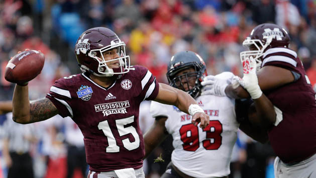 Dec 30, 2015; Charlotte, NC, USA; Mississippi State Bulldogs quarterback Dak Prescott (15) throws a pass during the first quarter against the North Carolina State Wolfpack in the 2015 Belk Bowl at Bank of America Stadium. Mandatory Credit: Jeremy Brevard-USA TODAY Sports