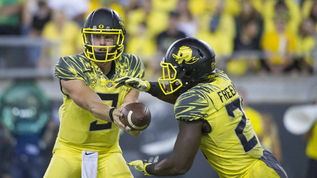 Sep 10, 2016; Eugene, OR, USA; Oregon Ducks quarterback Dakota Prukop (9) hands off to running back Royce Freeman (21) against the Virginia Cavaliers during the second quarter at Autzen Stadium. Photo Credit: Cole Elsasser-USA TODAY Sports