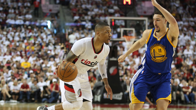 May 7, 2016; Portland, OR, USA; Portland Trail Blazers guard Damian Lillard (0) dribbles past Golden State Warriors guard Klay Thompson (11) in game three of the second round of the NBA Playoffs at Moda Center at the Rose Quarter. Mandatory Credit: Jaime Valdez-USA TODAY Sports